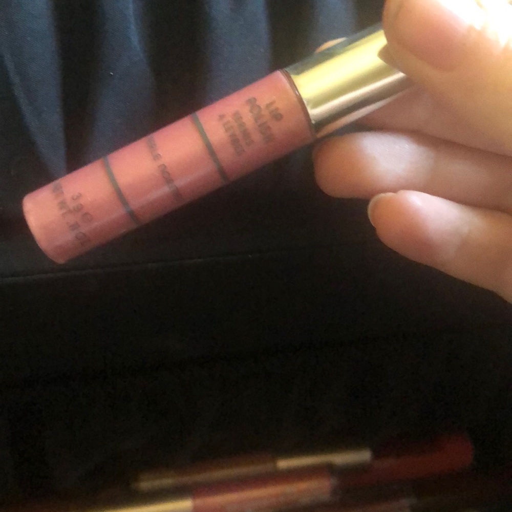 Merle Norman lip polish in the color “gumdrop”